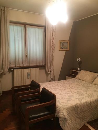 Ένα ή περισσότερα κρεβάτια σε δωμάτιο στο Sentirsi a casa