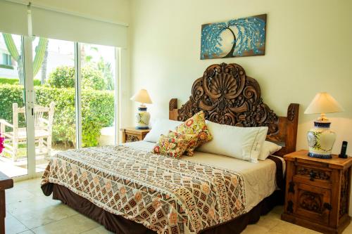 מיטה או מיטות בחדר ב-Cabo Cottage Villa Neptuno Charming Villa in Cabo Quiet View Ocean Community