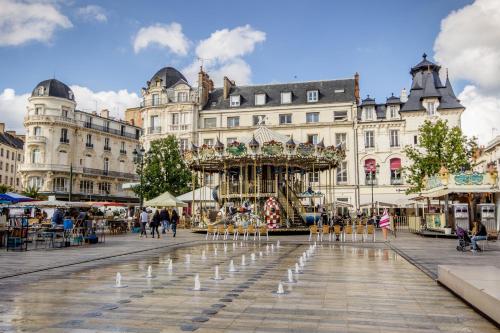a christmas market in a city with a fountain at Orleans - Fleury Les Aubrais - gare SNCF in Fleury-les-Aubrais