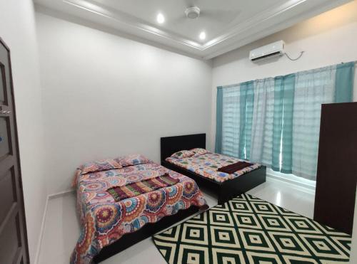 Кровать или кровати в номере Ar-Rayyan Homestation