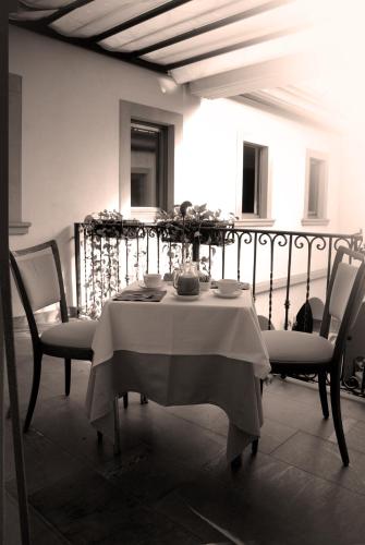 a table and chairs in a room with a table and chairs at Hotel Sebino in Sarnico