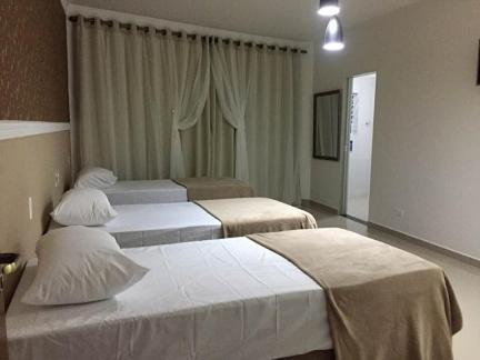 En eller flere senger på et rom på Hotel Guarulhos