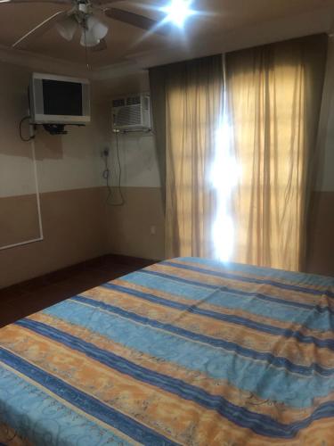 Ein Bett oder Betten in einem Zimmer der Unterkunft Hotel Playa María