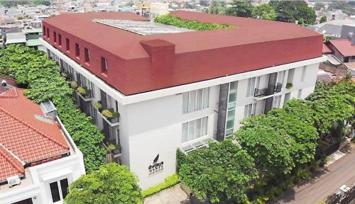 an overhead view of a building with a red roof at Dwijaya House of Pakubuwono in Jakarta