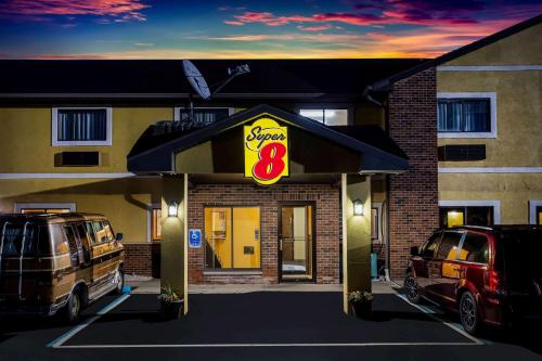 a restaurant with an sign in front of a building at Super 8 by Wyndham Crawfordsville in Crawfordsville