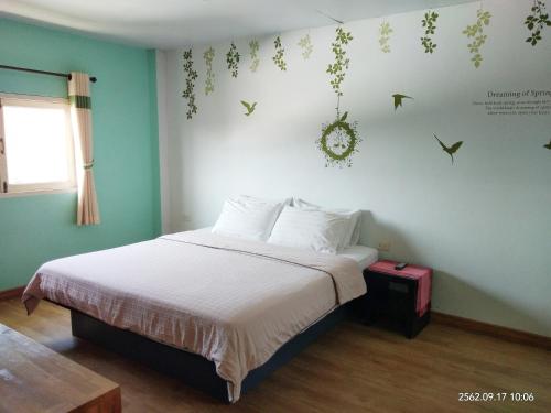 Ένα ή περισσότερα κρεβάτια σε δωμάτιο στο Dozy Lamoon House