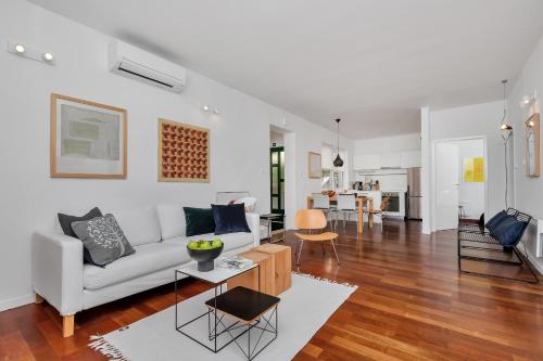 a living room with a couch and a table at Apartments Ratac in Tučepi