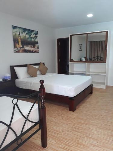 Postel nebo postele na pokoji v ubytování Nirvana Resort Puerto Galera
