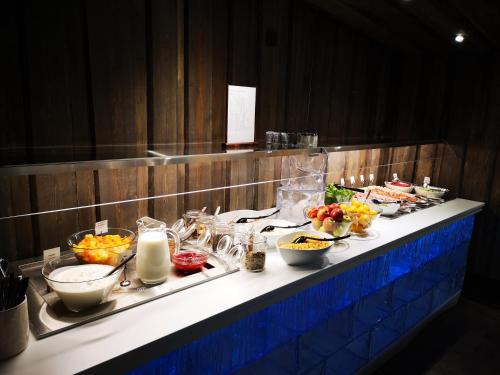 a buffet line with many different foods on it at Arctic SnowHotel & Glass Igloos in Sinettä