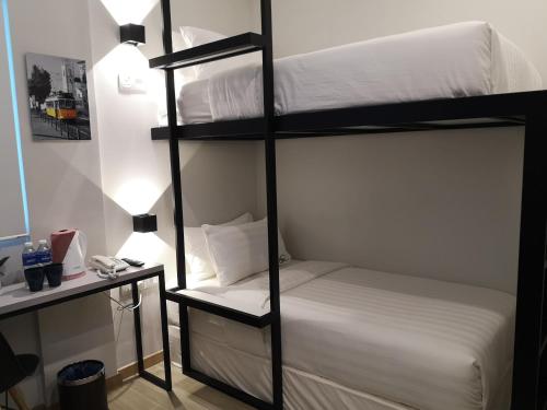 Ένα ή περισσότερα κρεβάτια σε δωμάτιο στο Apex Boutique Hotel @ Bandar Sunway
