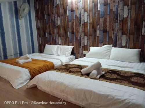 Ένα ή περισσότερα κρεβάτια σε δωμάτιο στο KS 88 Terrace Homestay 15Pax 4R2B nearby LotusTesco