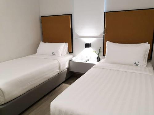 Ένα ή περισσότερα κρεβάτια σε δωμάτιο στο Apex Boutique Hotel @ Bandar Sunway