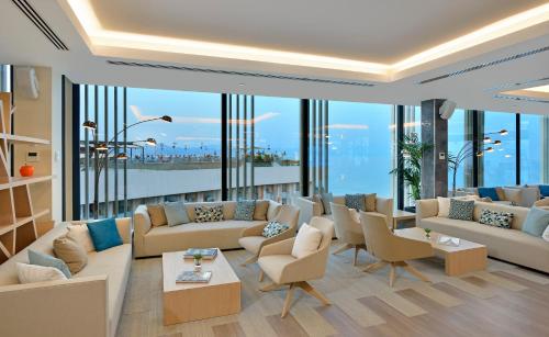 a living room filled with furniture and a large window at Melia Costa del Sol in Torremolinos