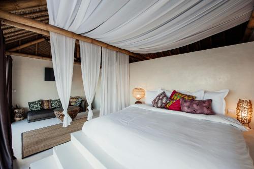 מיטה או מיטות בחדר ב-La Crique Nature & Spa
