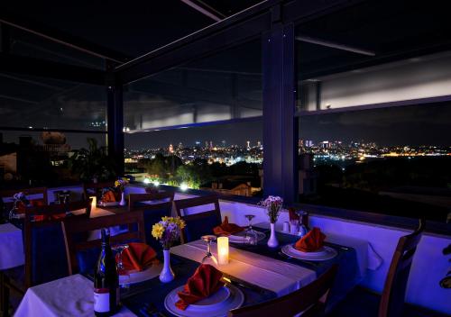 a restaurant with a view of the city at night at Antusa Design Hotel & Spa in Istanbul