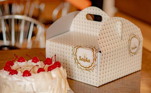 a cake in a heart shaped box on a table at Sasha Transit Hotel in Katunayake