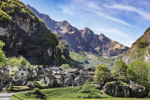 a village in a valley with mountains in the background at Be easy In Selva in Locarno