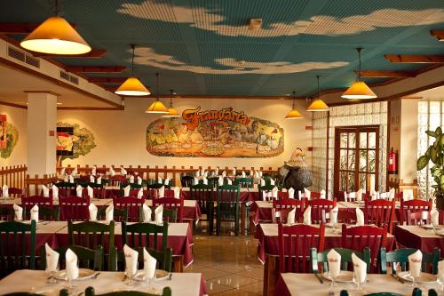 
a large dining room with tables and chairs at Hospedaria Frangaria in Faro
