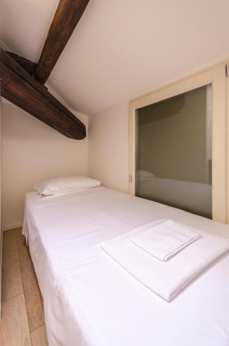 Cama o camas de una habitación en Appartamento del Nettuno