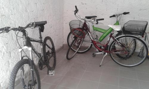 two bikes are parked next to a wall at Casa Del Mulino in Levanto
