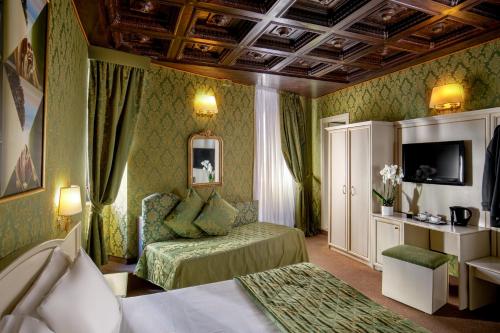 a hotel room with two beds and a television at Residenza Canova Tadolini - Guesthouse in Rome