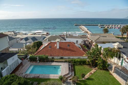 an aerial view of a house and the ocean at Chartfield Guesthouse in Kalk Bay