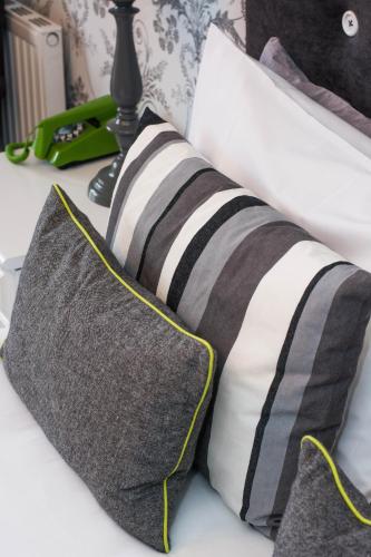 a close up of two pillows on a bed at Beachlands Hotel in Weston-super-Mare