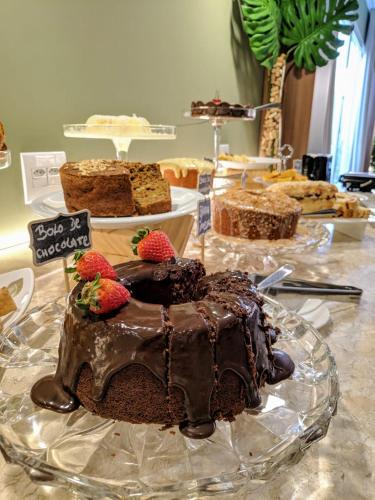 a chocolate cake with strawberries on a table at VIE HOTEL in Sinop