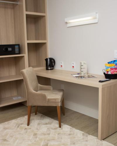 a desk and a chair in a room at VIE HOTEL in Sinop