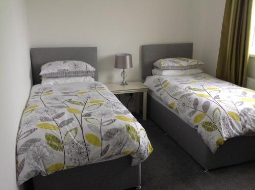 Ein Bett oder Betten in einem Zimmer der Unterkunft Tivoli Place