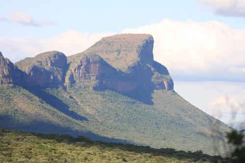 a view of a mountain with trees on it at Vilagama Game Lodge in Naboomspruit