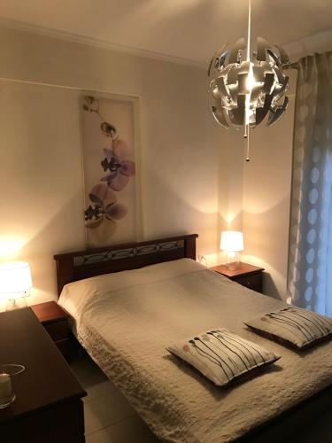מיטה או מיטות בחדר ב-Apartament in Thessaloniki