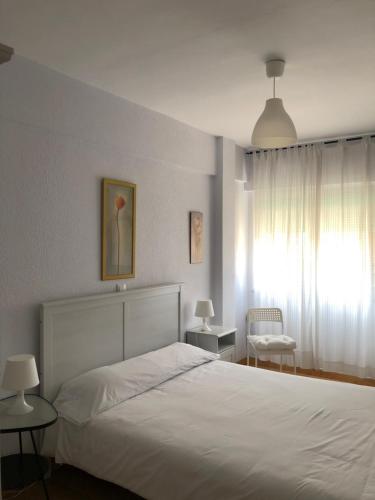 Ένα ή περισσότερα κρεβάτια σε δωμάτιο στο Apartamento Torrelavega