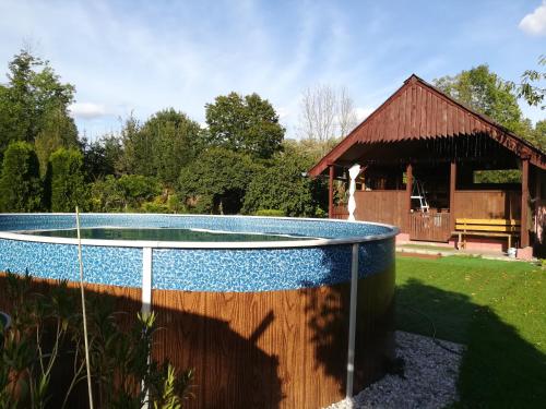 a swimming pool in a yard with a barn at Private Světluška in Poběžovice