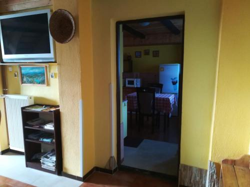 a room with a door open to a dining room at Private Světluška in Poběžovice