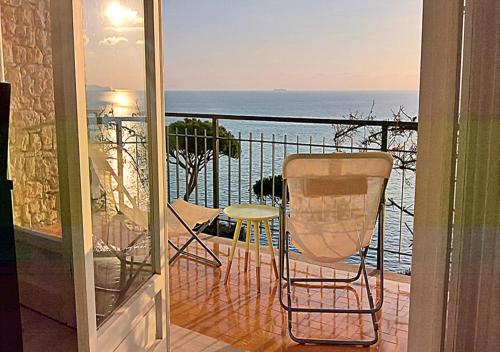 a balcony with chairs and a view of the ocean at Fiori Sul Mare in Tellaro
