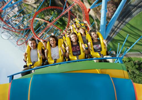 a group of people riding on a roller coaster at PortAventura Hotel Colorado Creek - Includes unlimited access to PortAventura Park & 1 access to Ferrari Land in Salou