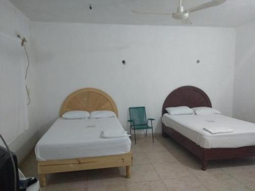 Cama o camas de una habitación en Hospedaje Papagrande