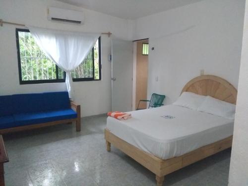 Postel nebo postele na pokoji v ubytování Hospedaje Papagrande