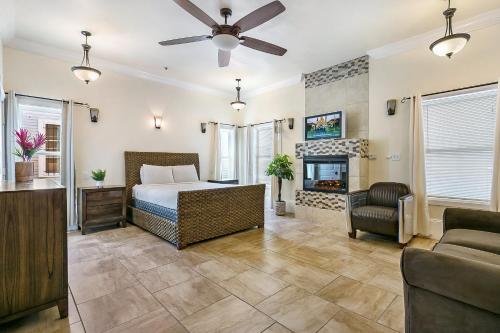 a bedroom with a bed and a fireplace at Spacious 4BR City Condo steps from St Charles Ave in New Orleans