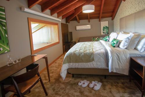Cama ou camas em um quarto em Hotel Vinícola Davo