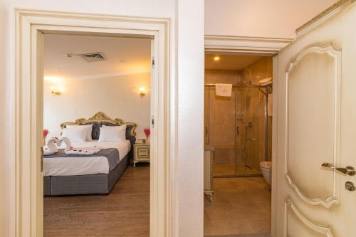 Katil atau katil-katil dalam bilik di Almadina Hotel Istanbul