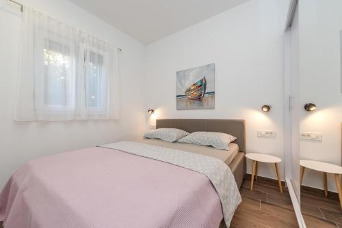 Posteľ alebo postele v izbe v ubytovaní Angela Luxury Apartment II