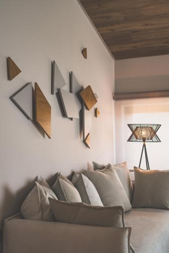 a living room with a couch and wooden ceilings at Sueño LUXURY VILLA, in Argasi 180 Iconic Sea View in Argasi