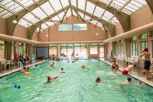 a group of people in a swimming pool at Mount Hood Village Premium Yurt 4 in Welches