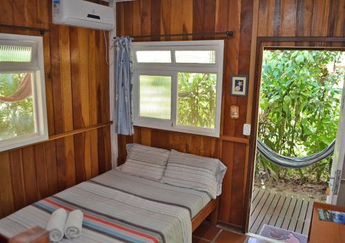Cama ou camas em um quarto em Pousada Renascer