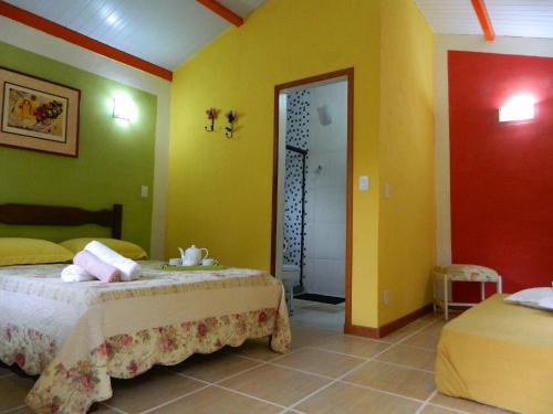 Cama o camas de una habitación en Bicho do Mato Suites
