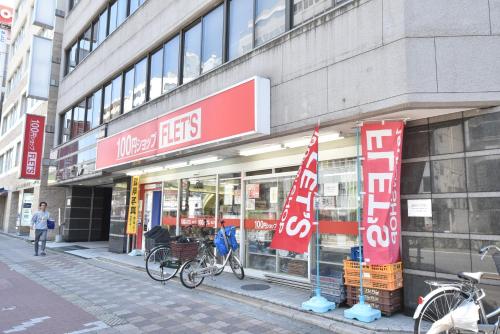 a store with bikes parked in front of a building at Enzo Shin-Osaka C in Osaka