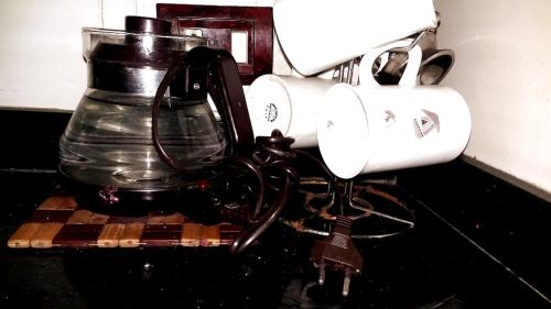 a blender on a rack with a key on it at Private Room In Apartment with Sea & Hilton View in Alexandria