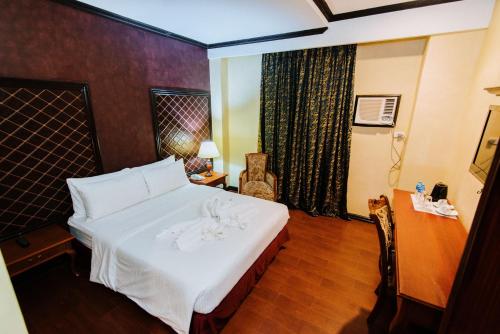 Postel nebo postele na pokoji v ubytování Hotel San Marco